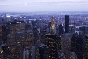 East Side of Midtown Manhattan, showing the terraced crown of the Chrysler Building lit at twilight
