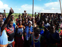 Karamojong villagers living in Moroto District celebrate the recent rains and the delivery of seeds and farming equipment from the Ugandan government.