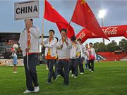 Chinese delegates with the PRC flag marching into the stadium for the World Sports Festival.