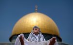 With the Dome of the Rock Mosque seen in the background, a Palestinian Muslim worshiper prays during the third Friday prayers of the Muslim holy month of Ramadan, in the Al-Aqsa Mosque compound in Jerusalem's Old City on Friday, Aug. 27, 2010. (ADEK BERRY/AFP/Getty Images)