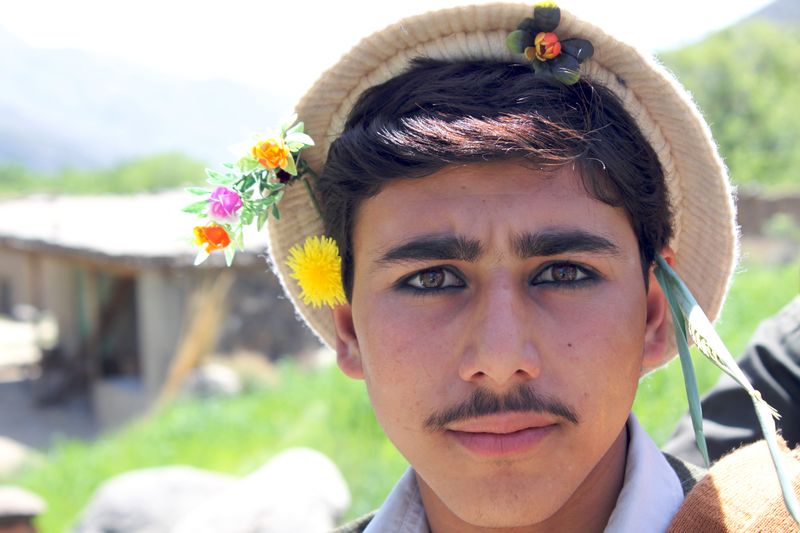 ملف:Young Pashai man with flowers in his hair.jpg