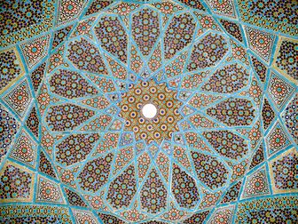 Complex girih patterns with 16-, 10- and 8-point stars at different scales in ceiling of the Tomb of Hafez in Shiraz, 1935
