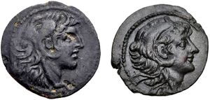 Two coins. Obverses are shown. To the left, a coin of Alexander I depicting him wearing a headdress in the shape of a lion head. On the right, a coin of Alexander II depicting him wearing the same headdress