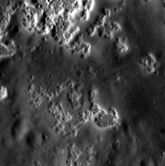 Surface hollows in the wall of crater Sholem Aleichem,[36] possibly formed by loss of a volatile crustal component[37]