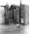 A small South Korean child sits alone in the street, after elements of the U.S. 1st Marine Div. and South Korean Marines invaded the city of Inchon, in an offensive launched against the North Korean forces in that area. September 16, 1950. Pfc. Ronald L. Hancock. (U.S. Army)