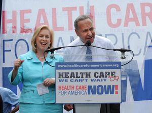 Kirsten Gillibrand and Chuck Schumer are seen giving a speech promoting universal healthcare.