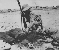 British soldier feeding a starving Turkish soldier.