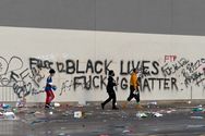 "Black Lives Fucking Matter" and "Fuck 12" graffiti on a looted Target store in Lake Street, Minneapolis, the morning of May 28