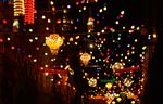 A Palestinian Muslim man decorates an alley of Jerusalem's old city with festive lights in preparation for Ramadan on Tuesday, Aug. 10 2010. (AP Photo/Muhammed Muheisen)