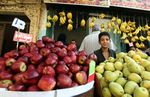 Egyptians buy fruits at a shop in downtown Cairo on August 20, 2010 during Islam's holy fasting month of Ramadan. Egyptians have been complaining from shortages of basic services during Ramadan, which began the first week of August amid sweltering summer temperatures. (KHALED DESOUKI/AFP/Getty Images)