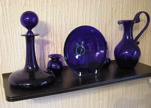 shelf with blue glass vessels