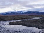 Polar landscape with a river and mountains