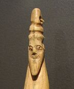 Hippopotamus tusk with carved head of a bearded man with torus-like headgear, Late Naqada I – Early Naqada II, 3800–3400 BC. Brooklyn Museum.[11]