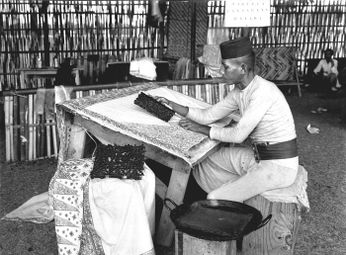 An Arab Indonesian working on batik wax stamps to work in Tanah Abang