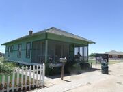 The McCroskey House was built by George Edwards in 1917 and was originally near Pecos and Dobson Roads. The house was sold to the McCroskey family and is at Tumbleweed Park at 2250 S. McQueen Road. It is listed as historic by the Chandler Historical Society.