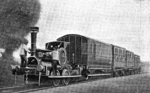 Small locomotive hauls four coaches of various designs