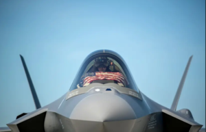 An F-35 pilot prepares for take off from the Vermont Air National Guard Base with the flag of the United States, May 22, 2020.PNG