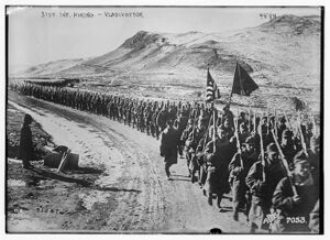 Black and white photo of soldiers marching