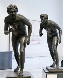 Bronze athletes identified as either runners or wrestlers from the square peristyle