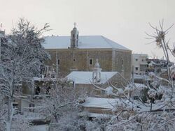 Ain Ebel in the winter, with Our Lady of Ain Ebel church in the background
