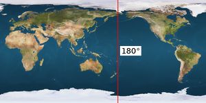 A map of the Earth with the Pacific Ocean in the centre, with a vertical red line running the full height just west of the Bering Strait and east of New Zealand.
