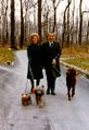 Richard and Pat Nixon walking their dogs in Camp David.