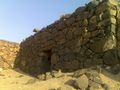 Ruins of a stone wall in Saudi Arabia.jpg