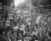 Allied military personnel in Paris celebrating V-J Day