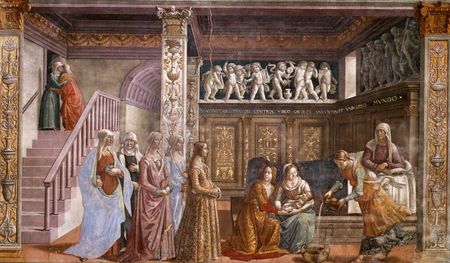 Fresco. St Anne rests in bed, in a richly decorated Renaissance room. Two women hold the newborn baby Mary, while a third prepares a tub to bath her. A group of richly-dressed young women are visiting. On the left is a staircase with two people embracing near an upper door.