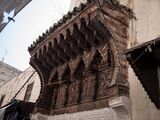 مظلة خشبية فوق مدخل مسجد أبو الحسن، القرن الرابع عشر.