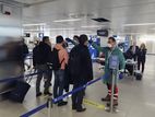 Passengers at Linate Airport in Milan have their temperatures taken
