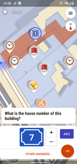 A map with different colored icons on it, currently a quest about a house number