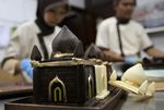 Indonesian chefs make miniature chocolate mosques for sale during the fasting month of Ramadan, at a chocolate shop in Jakarta, Indonesia, Friday, Aug. 20, 2010. (AP Photo/Tatan Syuflana)