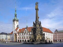Horní Square – the largest square in Olomouc (on right, the Holy Trinity Column; to the left, the Olomouc City Hall with its astronomical clock)