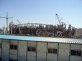In the foreground, workers' accomodation. In the background, Beijing 2008's National Stadium, under construction.