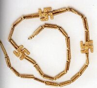 A swastika necklace excavated from Marlik, Gilan province, northern Iran, circa 1,200 – 1,050 BCE