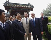 George H. W. Bush with son George W. Bush and China's President Hu Jintao in Beijing, People's Republic of China, August 10, 2008