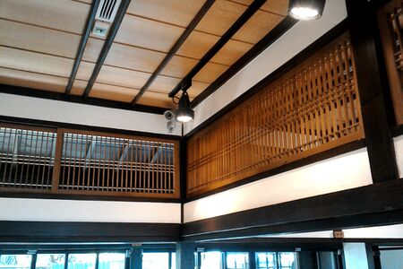 A ranma fanlight, unfilled for air circulation. Note fukiyose, clustered spacing of the laths.[46]