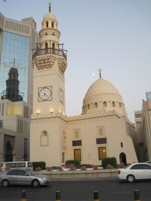 Mosque in Downtown Manama ( see Minaret reflection on building) (5933520288).jpg