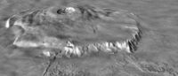 Oblique view of Olympus Mons, from a Viking image mosaic overlain on MOLA altimetry data, showing the volcano's asymmetry. The view is from the NNE; vertical exaggeration is 10×. The wider, gently sloping northern flank is to the right. The more narrow and steeply sloping southern flank (left) has low, rounded terraces, features interpreted as thrust faults. The volcano's basal escarpment is prominent.