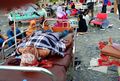 Survivors rest on beds outside a Palu hospital on September 29.jpg