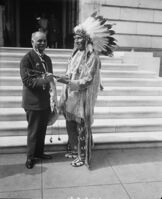 Vice President Curtis receives a peace pipe from Red Tomahawk, slayer of Sitting Bull