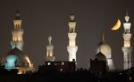The crescent moon is seen near mosques in old Cairo on the fifth day of the Muslim holy month of Ramadan on August 15, 2010. (REUTERS/Asmaa Waguih)