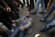 Clashes between security officials and protesters did break out, however. As many as six people have been reportedly killed across the country. Above, a wounded Egyptian demonstrator lies on the ground