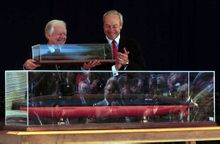 President Carter holding a model of the ship that carries his name.