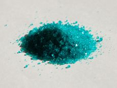 A small heap of cyan crystal particles