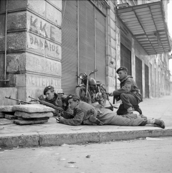 ملف:Paras from 5th (Scots) Parachute Battalion, 2nd Parachute Brigade, take cover on a street corner in Athens during operations against members of ELAS, 6 December 1944. NA20515.jpg