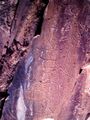 Paleolithic rock engravings breaking the natural rock formation