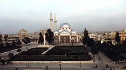 A religious building with multiple silver domes