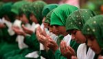 Muslim girls offer prayers before having their Iftar (fast-breaking) meal during the holy month of Ramadan at a madrasa on the outskirts of Jammu on August 21, 2010. (REUTERS/Mukesh Gupta)